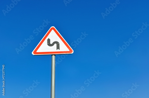Traffic sign warning drivers of curves in the road