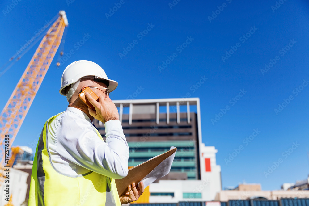 Engineer builder at construction site Engineer builder at construction site