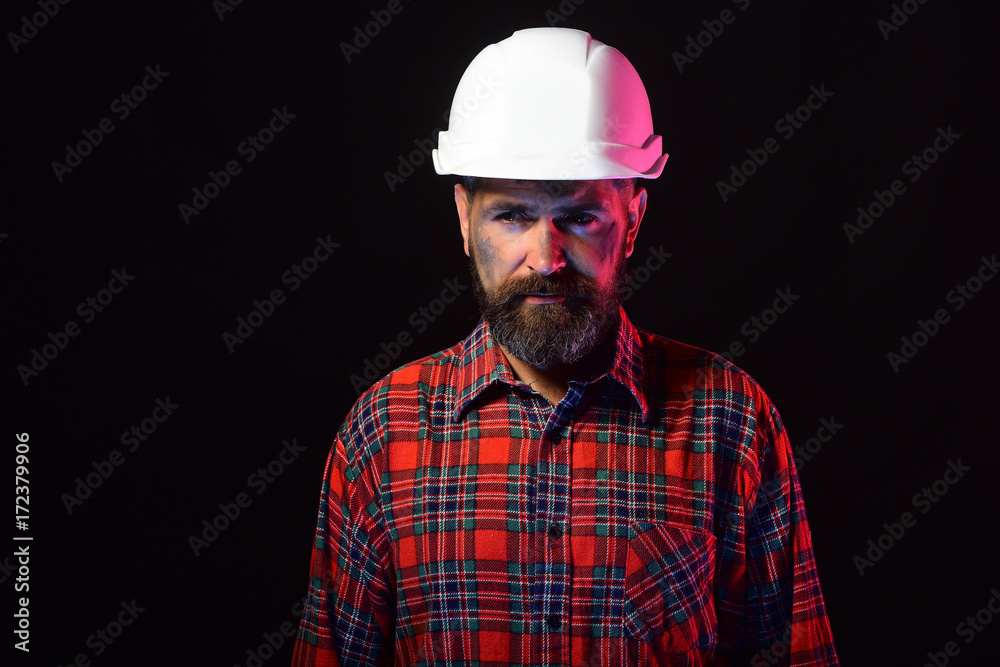 Labour and heavy industry concept. Builder or repairer with beard Labour and heavy industry concept. Builder or repairer with beard