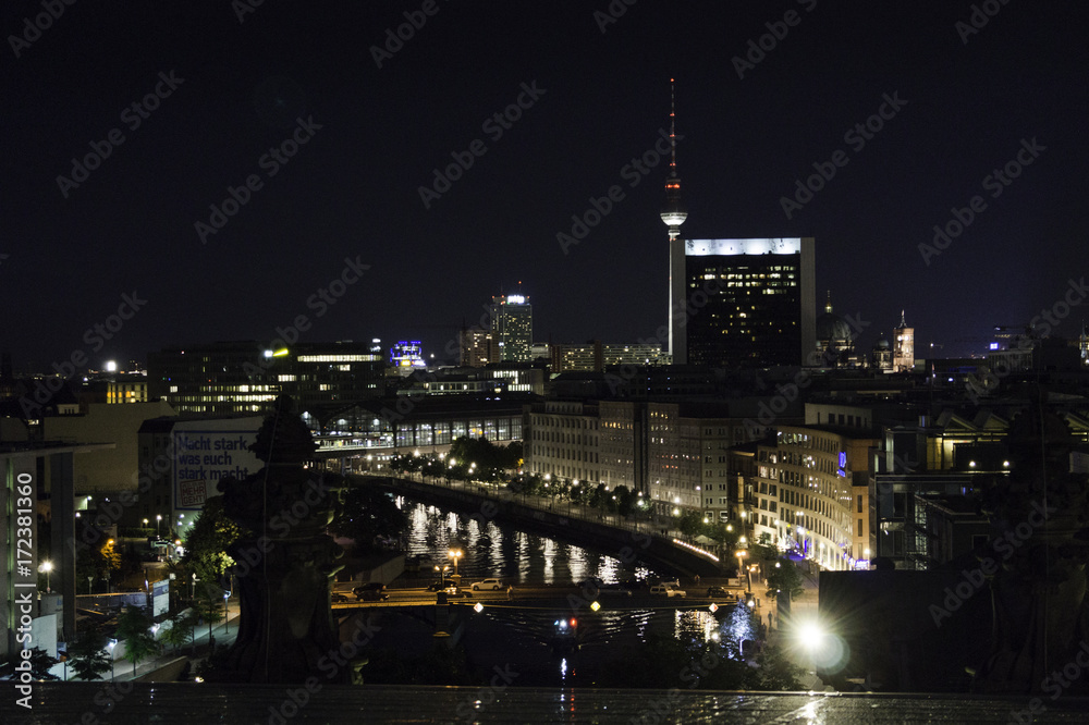 Reflections of the buildings on the Spree River and in the background the TV Tower in Berlin