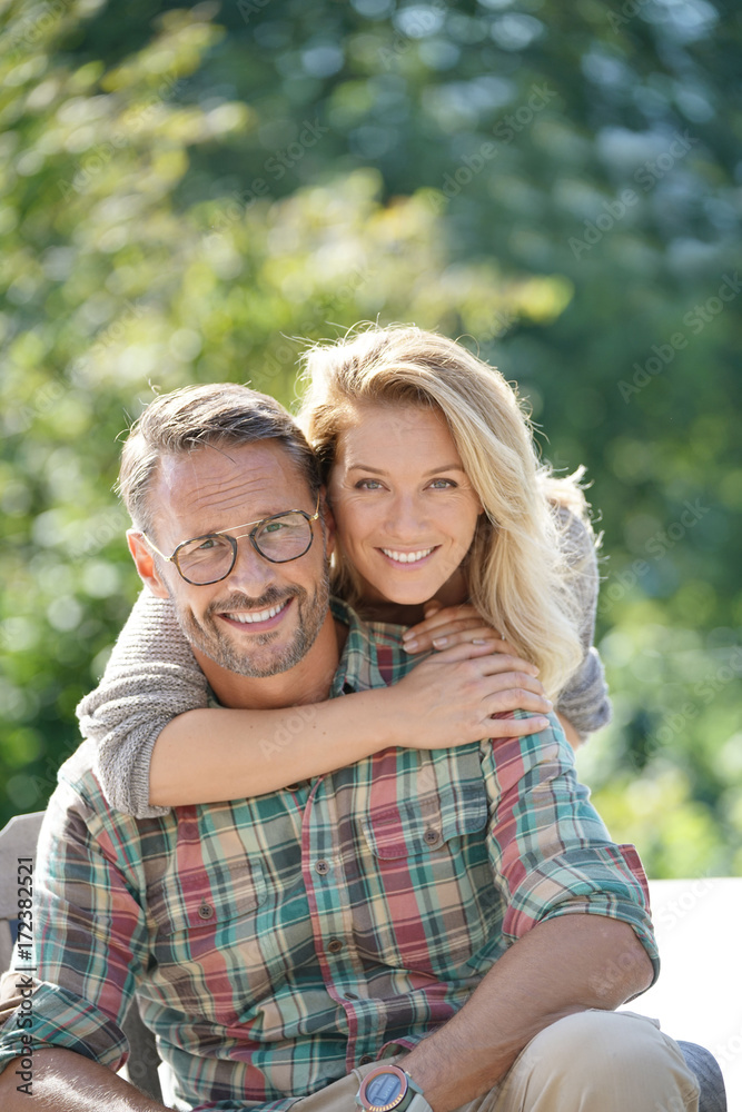 Portrait of mature couple enjoying sunny day in nature Portrait of mature couple enjoying sunny day in nature