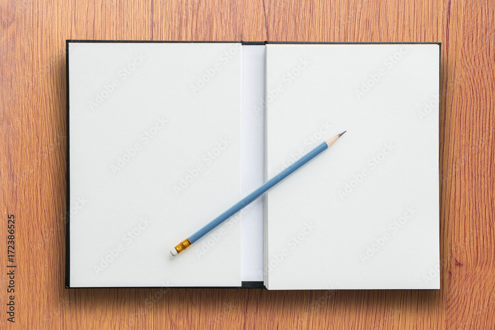 open notebook with pencil open notebook with pencil