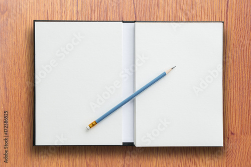 open notebook with pencil