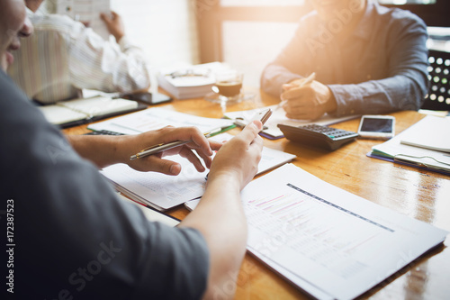 Co-workers are consultants on business documents, tax, transactions and business combinations after a bankrupt merger with a newly founded company. photo