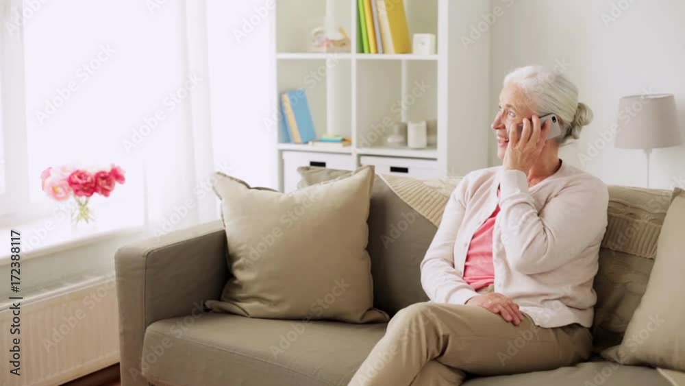 senior woman with smartphone calling at home senior woman with smartphone calling at home