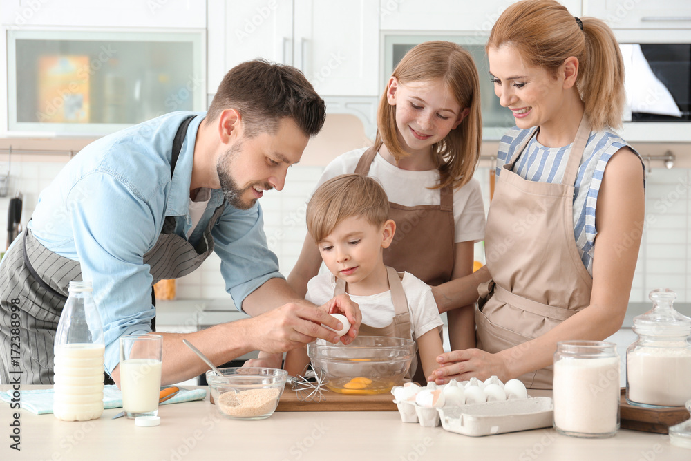 Family cooking in kitchen. Cooking classes concept Family cooking in kitchen. Cooking classes concept