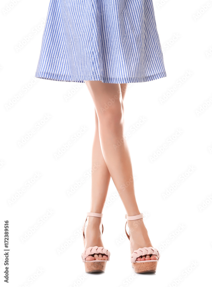 Young woman wearing dress and platform shoes on white background Young woman wearing dress and platform shoes on white background