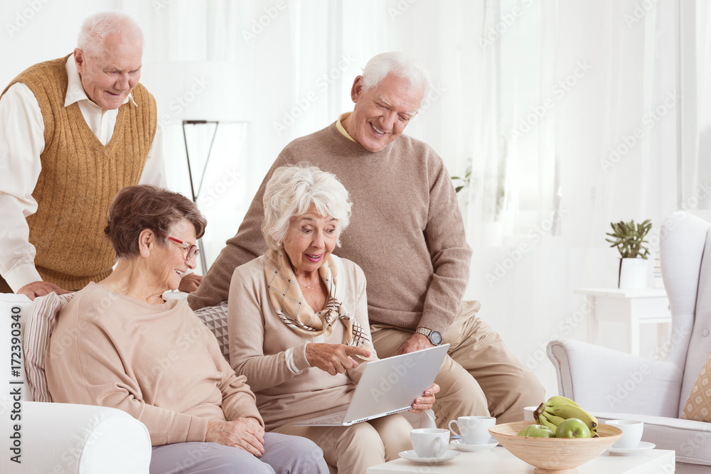 Elder friends are using laptop Elder friends are using laptop