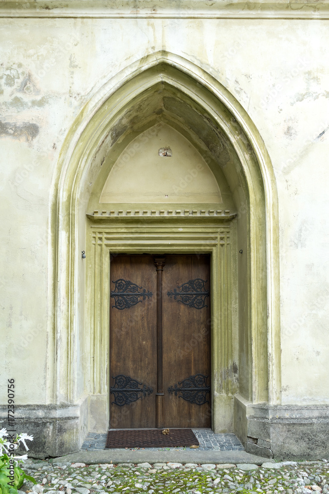 Arched door in an old stone building