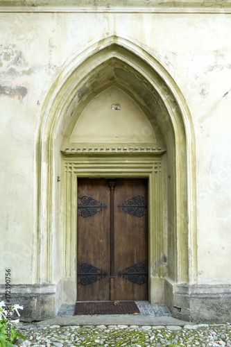Arched door in an old stone building