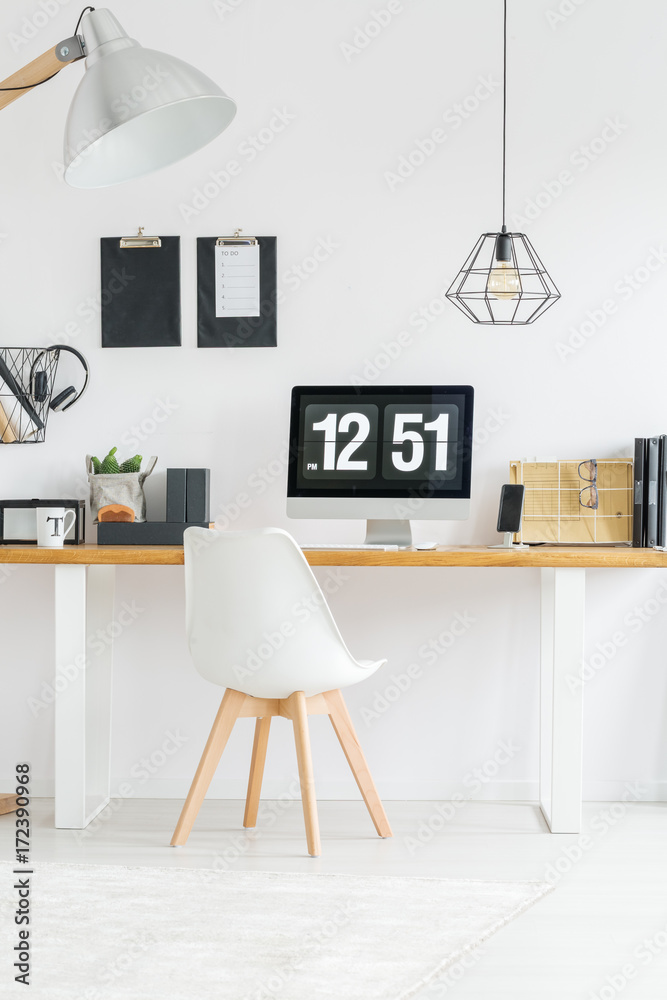 Obraz premium Minimalist workspace with designer chair