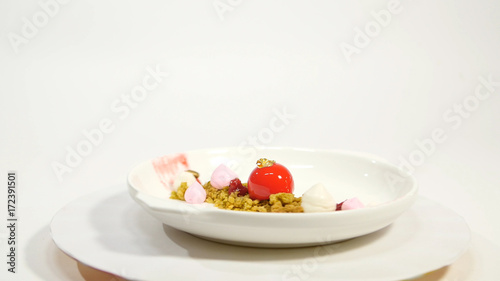 Dessert on the plate on white background. Beautiful delicious dessert on the plate. The presentation of the desserts in the United Arab Emirates