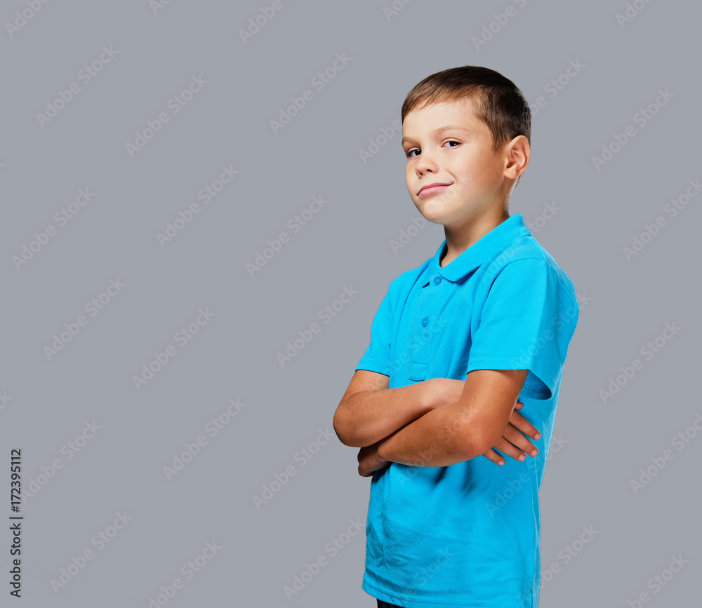 Studio portrait of a teenage boy with crossed arms. Studio portrait of a teenage boy with crossed arms.