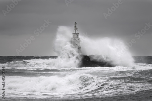 Storm near an old lighthouse in Achtopol bay, Black sea, Bulgaria