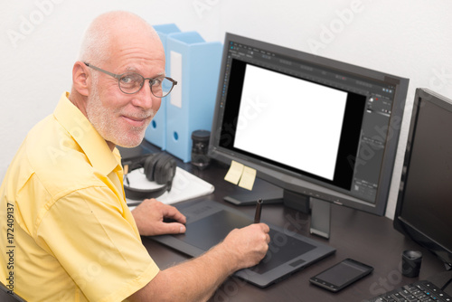 man designer using graphics tablet for editing