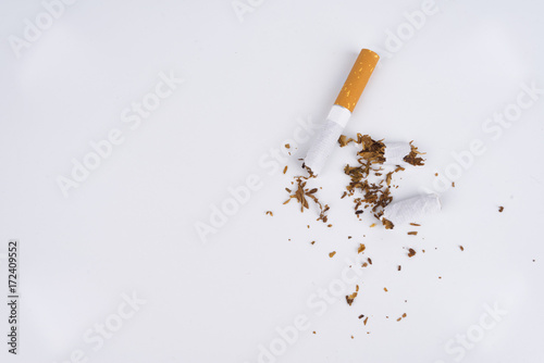 Concept World No Tobacco Day, and a Cigarette Damaged with Isolated White Background