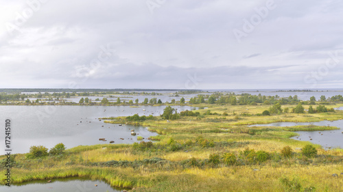 Beautiful view over fall colored grasslands by the sea. Natural background. photo
