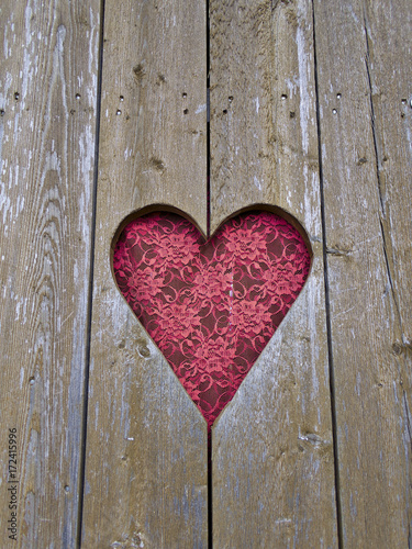 Heart shaped window with red curtain. Valentine's day background.