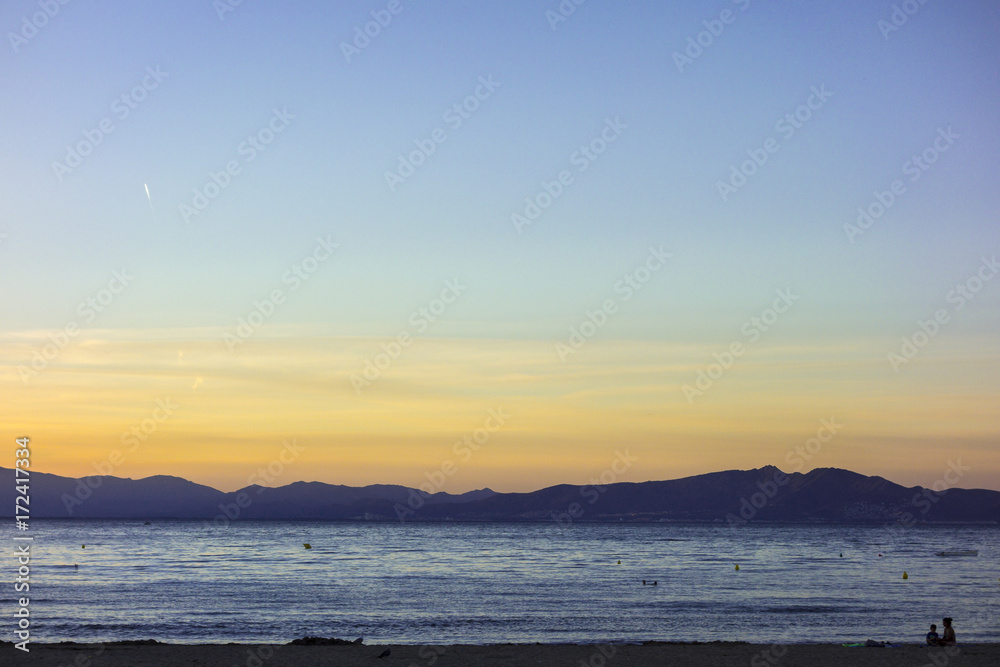 Sunset in quiet beach of l'Escala, Costa Brava.