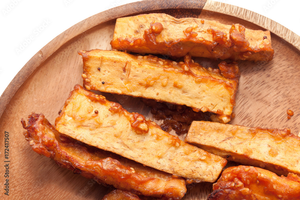 deep-fried sliced taro on wooden plate deep-fried sliced taro on wooden plate