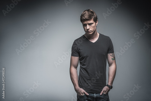 Sad guy looking down pensively