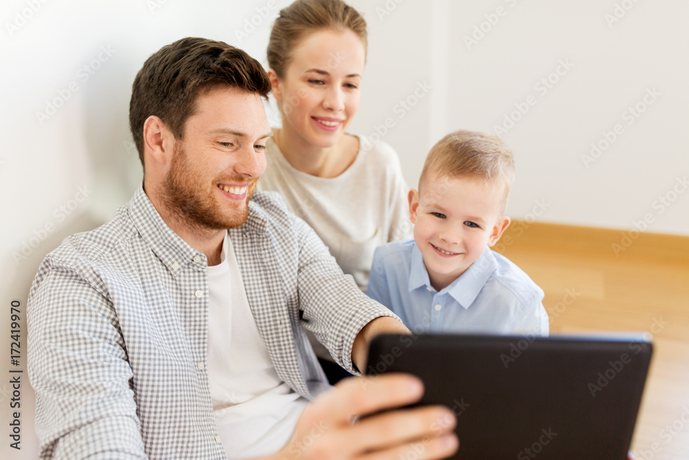 happy family with tablet pc moving to new home happy family with tablet pc moving to new home