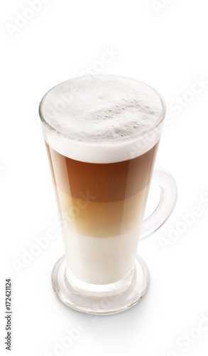 Cappuccino coffee isolated on white background. Foamy coffee and milk drink in a transparent glass cup.