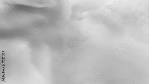 Animated inside of simulated hurricane in time lapse or eye of tornado spinning clockwise against black background. Mask included.