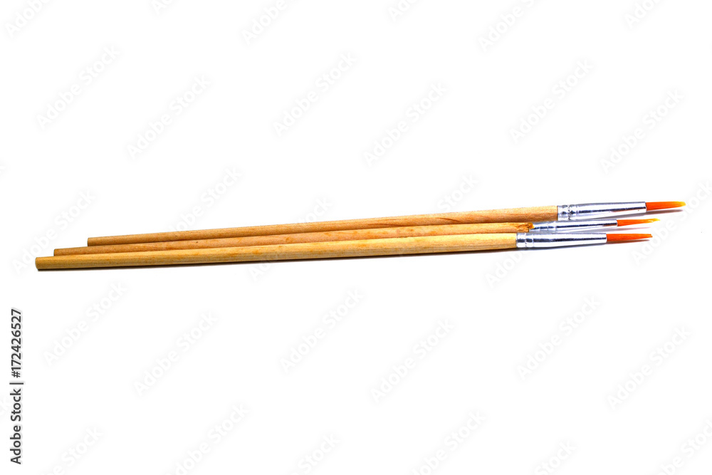 three paintbrush with wooden handle on white background isolated three paintbrush with wooden handle on white background isolated