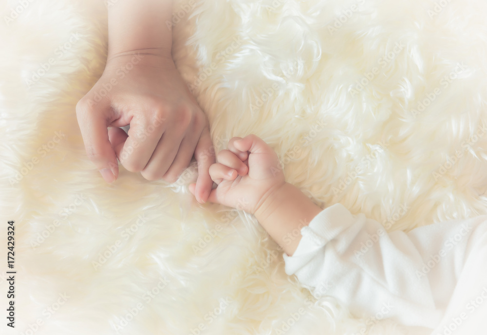 Touching hand, showing love, caring mother and child with each other. Touching hand, showing love, caring mother and child with each other.