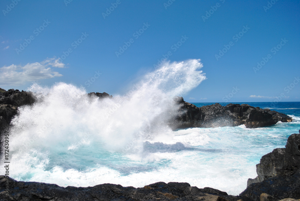 Waves crashing on black rocks, Gouffre Etant-salé, Reunion Island, France Waves crashing on black rocks, Gouffre Etant-salé, Reunion Island, France