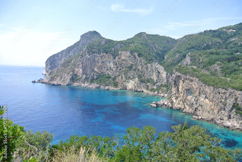 View of mountains and turquoise water to Paleokastritsa Corfou island Greece