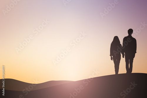 silhouette asian man woman lover couple dating walking on sunset hour sky background sepia tone color concept
