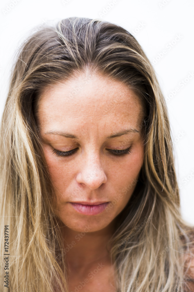 Portrait of the face of a beautiful blond woman on white background Portrait of the face of a beautiful blond woman on white background