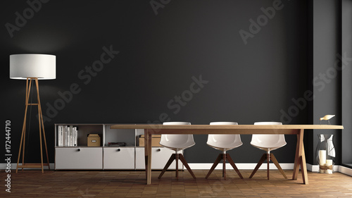 Esszimmer mit großem Holztisch vor dunkelgrauer Wand photo