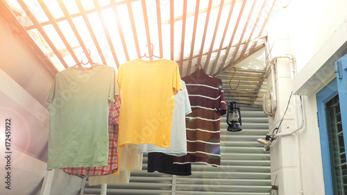 hang the clothes on the roof batten in house © silamime