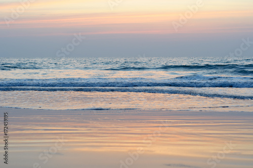 View from a beach on a sunset over the ocean. Coast of India  Indian Ocean