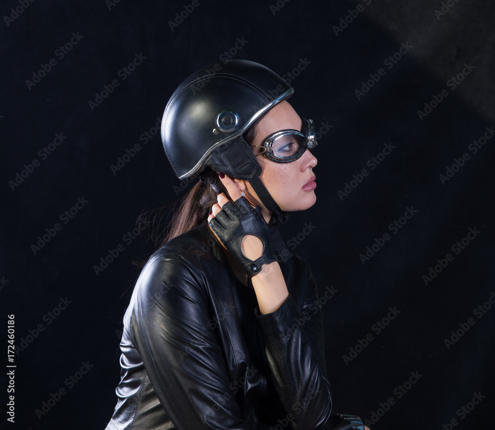 studio portrait of a biker girl studio portrait of a biker girl