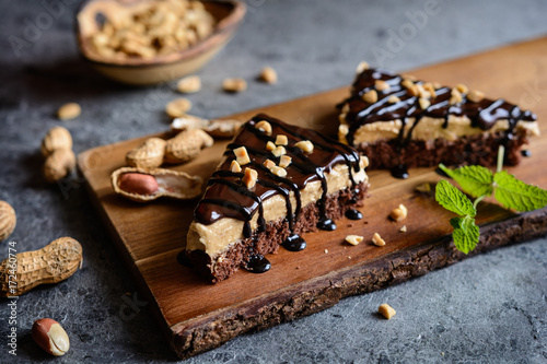 Delicious cake with peanut butter cream and chocolate topping