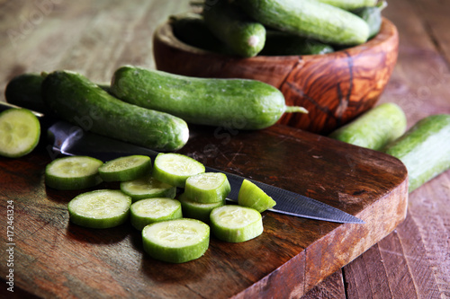 Fresh and sliced cucumbers. Sliced cucumbers on a cutting board. cucumbers for diet and healthy eating.