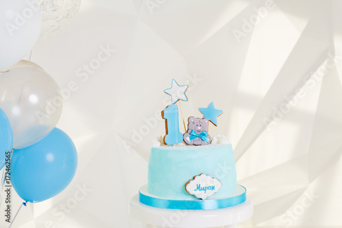 torso for the baby. cake for the year. Balloons photo