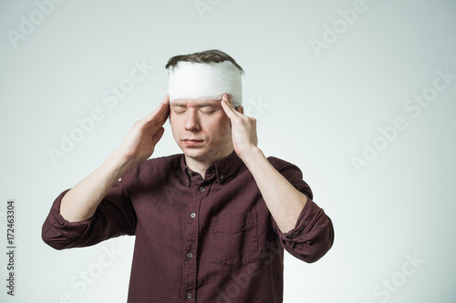 Man with bandage on his head