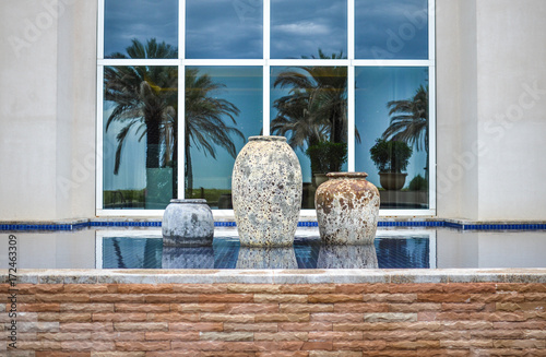 Old decorative pots in a pond, Abu Dhabi, UAE photo