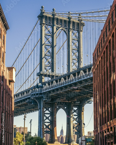 Fototapeta Naklejka Na Ścianę i Meble -  Empire State building through the Manhattan Bridge, Washington St, Dumbo, Brooklyn, New York, USA