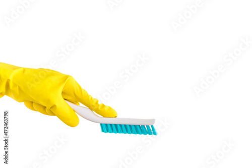 Cleaner s hand in the rubber protective glove holding a professional brush isolated on the white background. Cleaning product. Early spring cleaning or regular clean up.