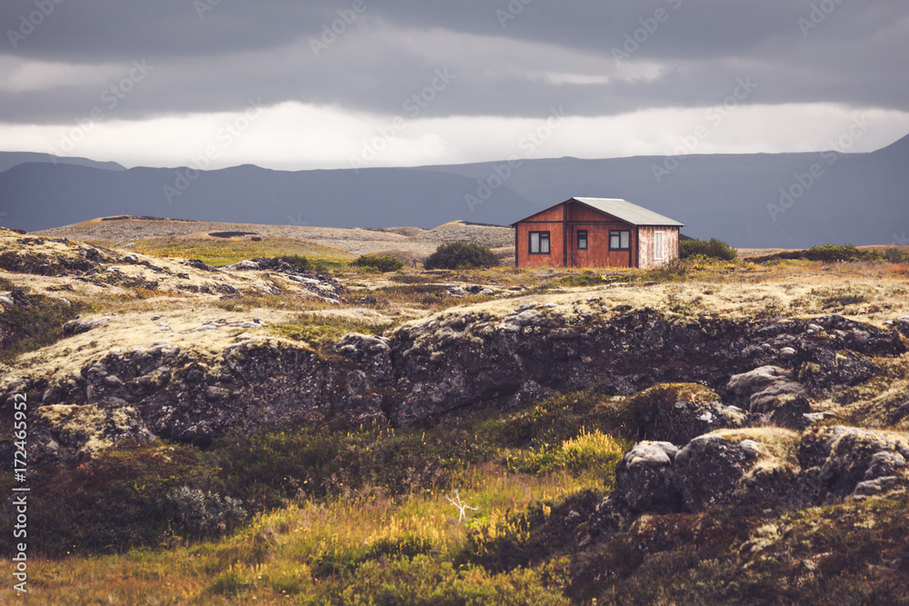 Small wooden cottage in Iceland landscape