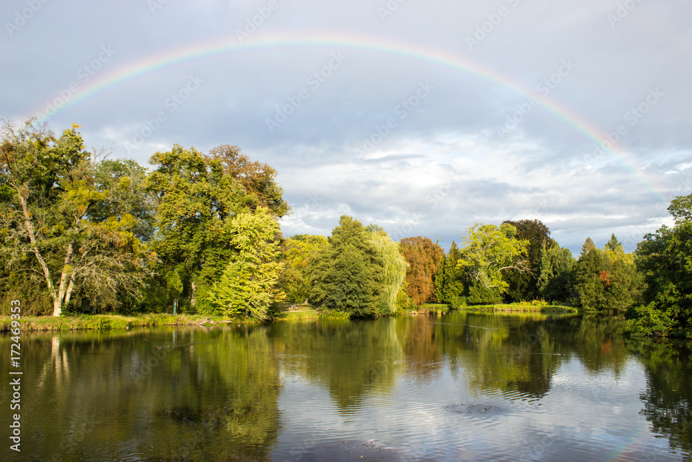 A pond with rainbow A pond with rainbow