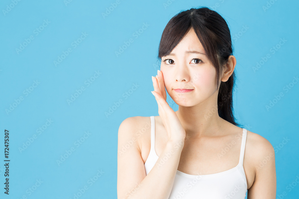 attractive asian woman beauty image isolated on blue background attractive asian woman beauty image isolated on blue background