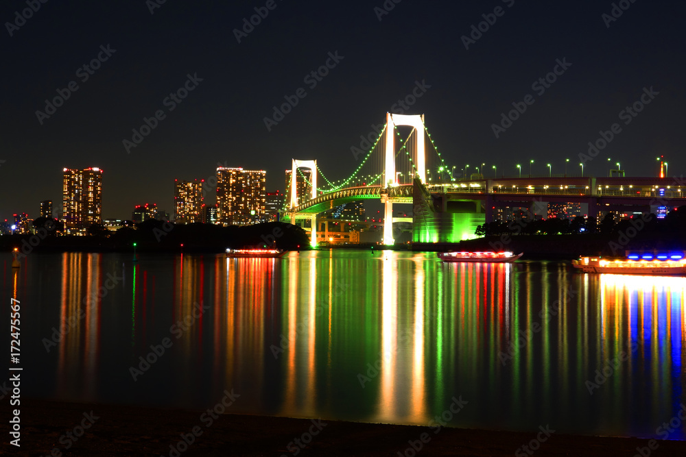 Skyline of Tokyo at night, bridge over river, Japan