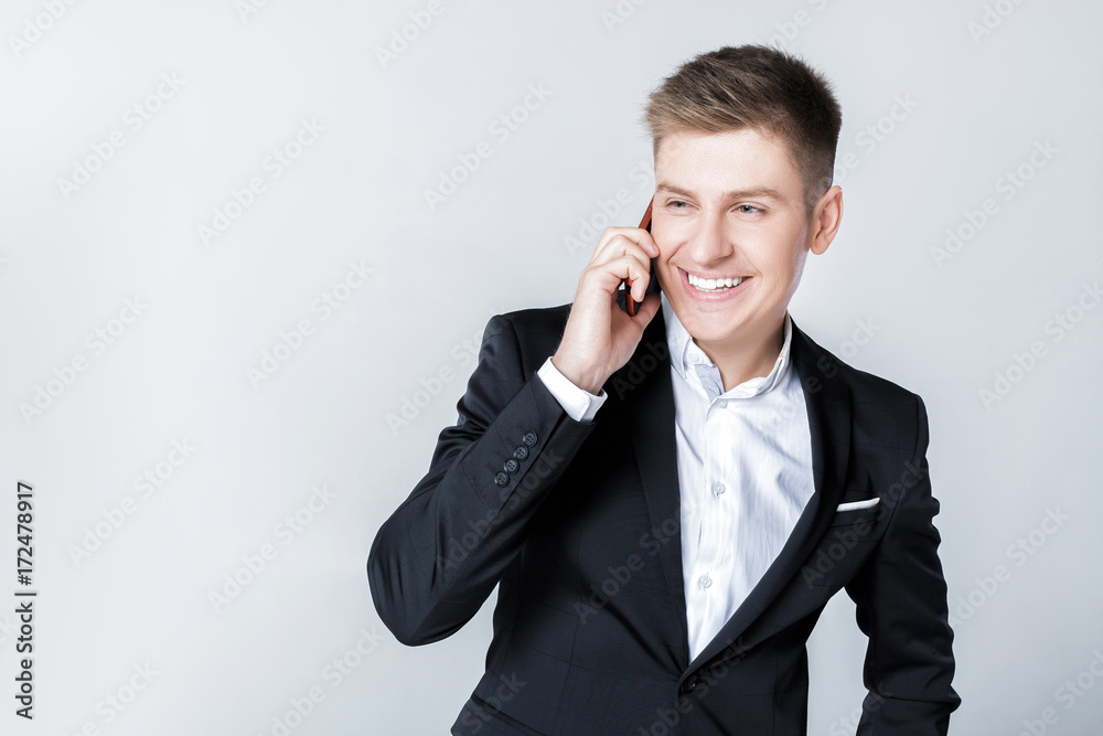 Business man in suit talking on the phone Business man in suit talking on the phone